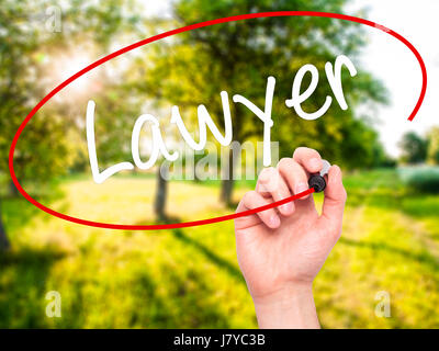 Man Hand writing Lawyer with black marker on visual screen. Isolated on background. Business, technology, internet concept. Stock Photo Stock Photo