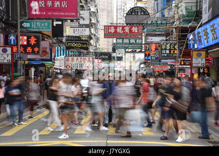 people walking on mong kok area, hong kong kowloon , people walking in hong kong . chinese sings , hong kong crowd , hong kong street Stock Photo