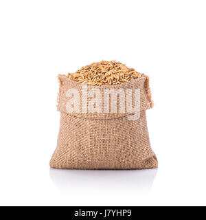 Paddy jasmine rice in sack bag isolated on white background Stock Photo ...