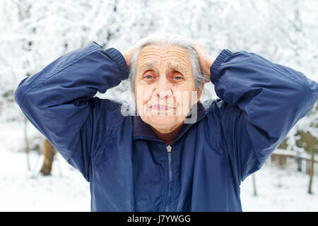 Picture of an old woman having a headache Stock Photo