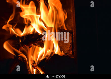 Close up of fire. Logs burning in sauna stove. Stock Photo