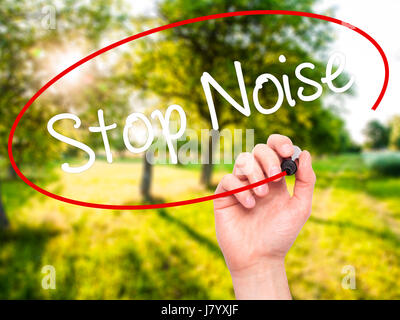 Man Hand writing Stop Noise   with black marker on visual screen. Isolated on background. Business, technology, internet concept. Stock Photo Stock Photo