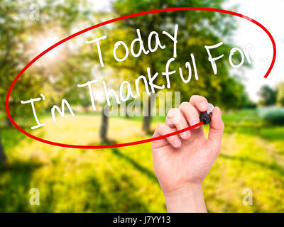 Man Hand writing Today I'm Thankful For... with black marker on visual screen. Isolated on nature. Life, technology, internet concept. Stock Image Stock Photo