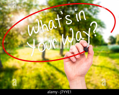 Man Hand writing What's in Your Way? with black marker on visual screen. Isolated on background. Business, technology, internet concept. Stock Photo Stock Photo