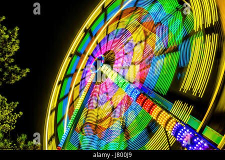 The West Coast Wheel.  You can’t have an amusement park without a ferris wheel!  Long exposure taken at Playland in Vancouver, B.C. Stock Photo