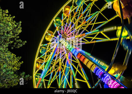 The West Coast Wheel.  You can’t have an amusement park without a ferris wheel!  Long exposure taken at Playland in Vancouver, B.C. Stock Photo