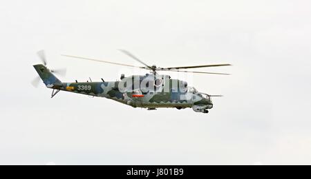 CASLAV, CZECH REPUBLIC - MAY 20, 2017: Exhibition of a large helicopter gunship and attack helicopter Mil Mi-24 in flight. Stock Photo