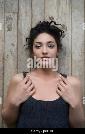 Beautiful young woman laying down on the floor Stock Photo