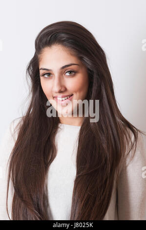 Happy young beautiful Indian woman smiling Stock Photo