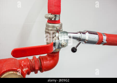 in the hallway of a nice building, there is a fire hose Stock Photo