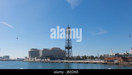 The port of Barcelona, at the end of the Ramblas. In the photo, the World trade center building and cable way tower in port of Barcelona, Catalonia, S Stock Photo
