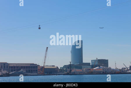 The port of Barcelona from the end of the Ramblas. In the photo, the sailing hotel and a cable car of Port Vell Aerial Tramway. Barcelona, Spain Stock Photo