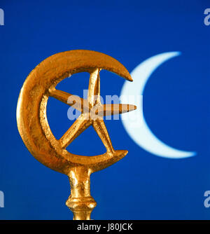 The crescent moon and star which became connected with Islam in the mid C20th. The  rich blue colour is often used in tiles to decorate mosques Stock Photo