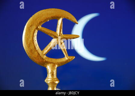 The crescent moon and star which became connected with Islam in the mid C20th. The  rich blue colour is often used in tiles to decorate mosques Stock Photo