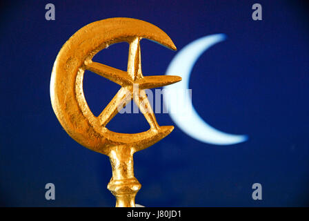 The crescent moon and star which became connected with Islam in the mid C20th. The  rich blue colour is often used in tiles to decorate mosques Stock Photo