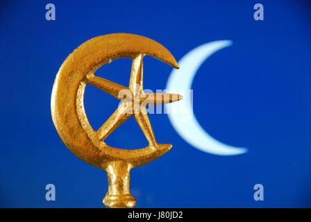 The crescent moon and star which became connected with Islam in the mid C20th. The  rich blue colour is often used in tiles to decorate mosques Stock Photo