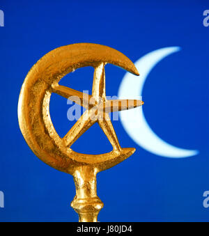 The crescent moon and star which became connected with Islam in the mid C20th. The  rich blue colour is often used in tiles to decorate mosques Stock Photo