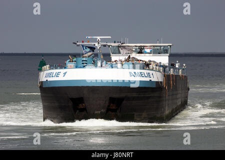 ROTTERDAM, NETHERLANDS - MAR 16, 2016: Front view of a barge moving on the Meuse river. Stock Photo