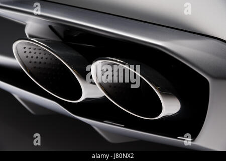 Chrome exhaust pipes on a sports car Stock Photo