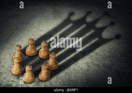 Chess pawn standing together, arranged in a circle joining the power, casting a crown shaped shadow. Business group leadership and team working concep Stock Photo