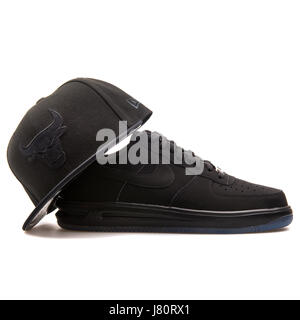 All Black Nike Air Force 1 sneaker and New Era Chicago Bulls Cap Stock Photo