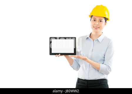 woman foreman showing digital tablet pad computer with blank screen isolated on white copyspace over clean background. profession and industry job con Stock Photo