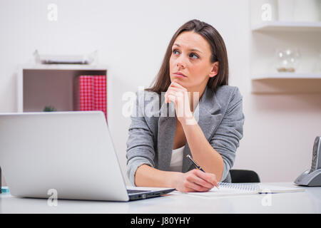 Young businesswoman is working in her office. Stock Photo