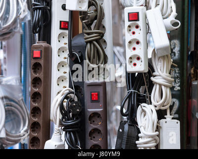 Continental European 220 volt power strips and multi socket adaptors for sale on a Serbian local market  Picture of power strips and electricity multi Stock Photo