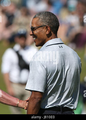 Former US president Barack Obama smiles after completing a round of golf at the Old Course in St Andrews, Fife, during his visit to Scotland. Stock Photo