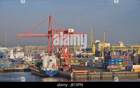 Ireland, County Dublin, Dublin Ferryport, cranes and freight containers seen from departing ferry vessel. Stock Photo