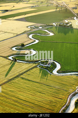 An aerial view of farmland and irrigation canals running through the fertile farm fields of Idaho. Stock Photo