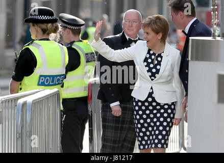 First Minister Nicola Sturgeon and her husband Peter Murrell (left) arrive at the Edinburgh International Conference Centre ahead of the Hunter Foundation event where former US president Barack Obama is due to speak. Stock Photo