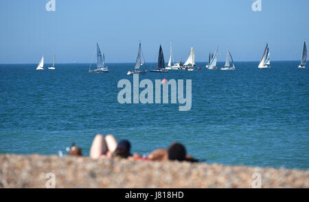 Brighton, UK. 26th May, 2017. Hundreds of yachts gather off Brighton beach for the start of the annual Royal Escape Race to France with today forecast to be the hottest day of the year so far with temperatures reaching the high 20s celsius in some parts of Britain Credit: Simon Dack/Alamy Live News Stock Photo