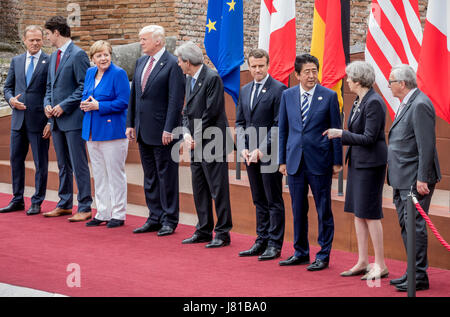 President of the European Council Donald Tusk (L-R) poses next to Canada's Prime Minister Justin Trudeau, Germany's Chancellor Angela Merken, US President Donald Trump, Italy's Minister President Paolo Gentiloni, President of France Emmanuel Macron, Japan's Shinzo Abe, Britain's Theresa May and President of the European Commission Jean-Claude Juncker for the "family portrait" in front of the Ancient Greek theatre at the G7 summit in Taormina in Sicily, Italy, 26 May 2017. The heads of the G7 states meet in Sicily from 26 May until 27 May 2017. Stock Photo
