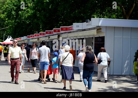 Madrid, Spain. 26th May, 2017. Opening of Madrid Book Fair. This 76th edition will be held from 26th May to 11th June and Portugal is the invited country. Today, the over 350 stalls set up along the Paseo de Carruajes avenue in Madrid's Retiro park offer the public discover the latest literary offerings, and also to meet their favourite writers. Credit: M.Ramirez / Alamy Live News Stock Photo