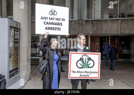 Toronto, Ontario, Canada. 26th May, 2017. May 26th marked one year since the ''Project Claudia'' raids and arrests started. Anti-cannabis law enforcement has continued in Toronto and across Canada in the last year criminalizing marijuana dispensaries. A protest was held at City Hall by Jodie and Marc Emery, owners of the Cannabis Culture dispensary demanding political change and to drop charges against marijuana in the city of Toronto to people charged with selling marijuana. In an open letter to the mayor of Toronto, Jodie Emery suggests that Toronto approaches the issue the same way Vancouv