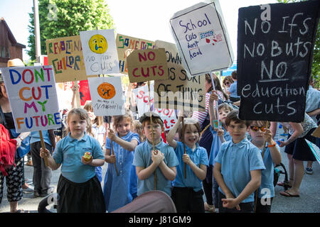 London, UK. 26th May, 2017. Children hold signs at a protest in Walthamstow by parents, children and relatives representing 17 local schools and a nursery against proposed education cuts. They had previously marched from the schools to the rally. Credit: Mark Kerrison/Alamy Live News Stock Photo