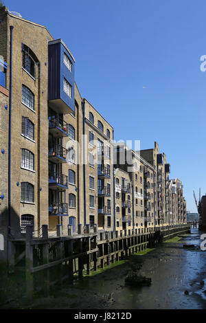 St Georges Wharf, a Victorian dock off the River Thames in Bermondsey, London, UK. Warehouses now converted to up-market offices and apartments Stock Photo
