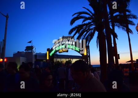 The iconic neon entrance sign at the famous Santa Monica pier in Los Angeles Stock Photo