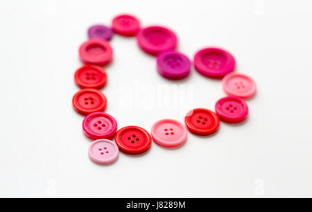 heart shape of sewing buttons Stock Photo