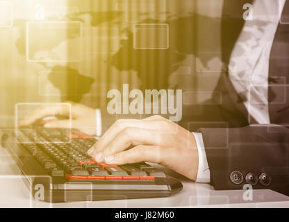 double exposure of business woman hands working on computer keyboard Stock Photo