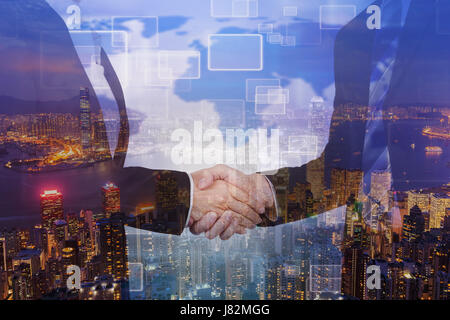 double exposure of shaking hand between businessman and businesswoman with a city background Stock Photo