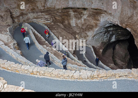 Carlsbad Caverns National Park, New Mexico - Tourists descend the switchbacks in the natural entrance to Carlsbad Caverns. Stock Photo