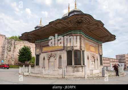 Istanbul, Turkey - May 7, 2017: The fountain of Sultan Ahmed III next to the Hagia Sophia Museum, one of the most significant landmarks in Istanbul Stock Photo
