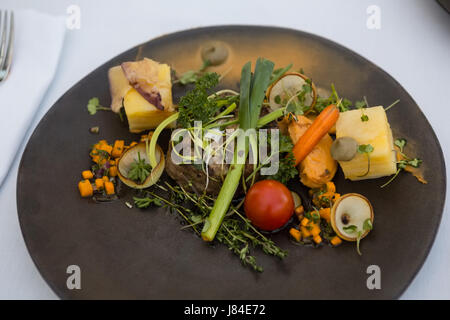 High angle view of tasty food served in plate on table in restaurant Stock Photo