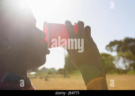 Man drinking beer from disposable glass in the park Stock Photo