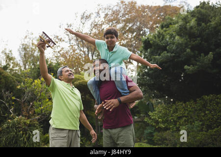 Low angle view of happy multi generation family enjoying at park Stock Photo
