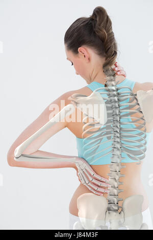 Digitally generated image of woman suffering from neck pain against white background Stock Photo