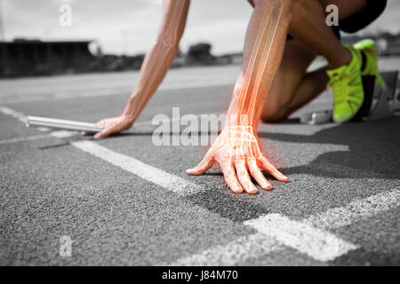 Digital composite of highlighted bones of man about to race Stock Photo