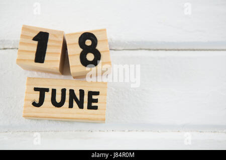 Close up of 18 june text on wooden blocks at table Stock Photo
